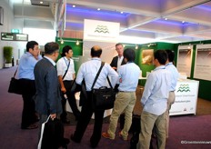 Luciën Knetemann explaining about Glasimport Greenhouses to several Asian guests.