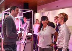 Jackie Davis and Caroline Wells receiving a visitor at the Heliospectra booth.